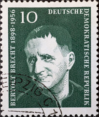 GERMANY, DDR - CIRCA 1957 : a postage stamp from Germany, GDR showing a portrait of the playwright and poet Bertolt Brecht. green