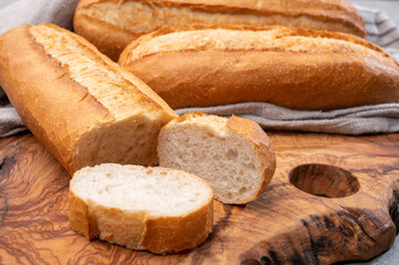 Ingredient for French breakfast, fresh baked crispy baguette white bread