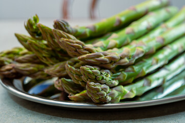 Bunch of fresh ripe green asparagus vegetables ready to cook or grill