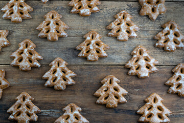 Christmas cookies in the shape of a Christmas tree. New Year's food. Anise star. Festive baked goods. Gingerbread on the table. Pattern