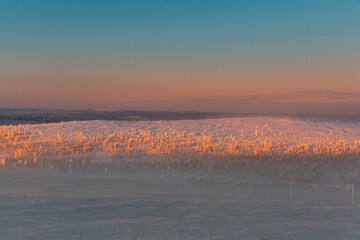 Winter landscape at sunrise in Finnish Lapland