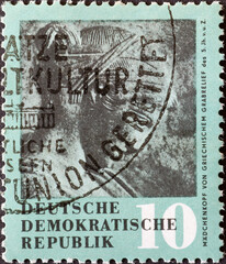 GERMANY, DDR - CIRCA 1958 : a postage stamp from Germany, GDR showing an ancient girl's head from a...