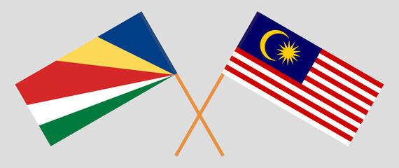 Crossed flags of Seychelles and Malaysia. Official colors. Correct proportion