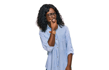 Fototapeta na wymiar Beautiful african young woman wearing casual clothes and glasses thinking worried about a question, concerned and nervous with hand on chin