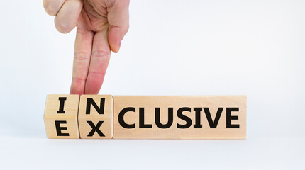 Inclusive or exclusive symbol. Businessman turns wooden cubes and changes words 'exclusive' to...