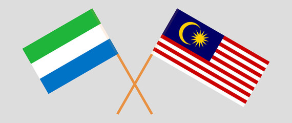 Crossed flags of Sierra Leone and Malaysia. Official colors. Correct proportion