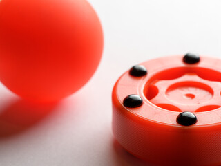 Inline hockey puck and ball on white background