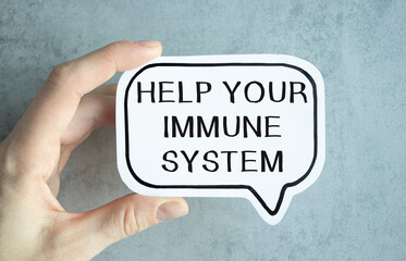 Boost Your Immune System. Woman calling attention to phrase, closeup. Composition on gray background