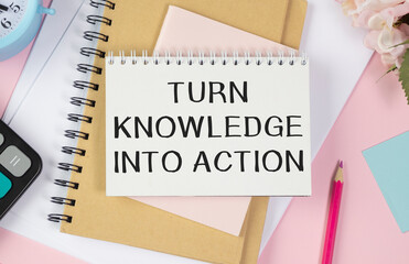 Text Turn knowledge into action on white paper background - business concept