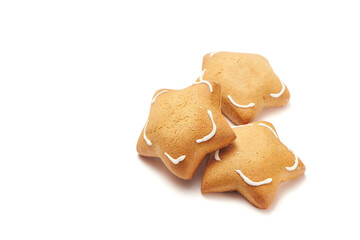 Freshly baked star shaped ginger cookies isolated on white background. Close Up, selective focus view