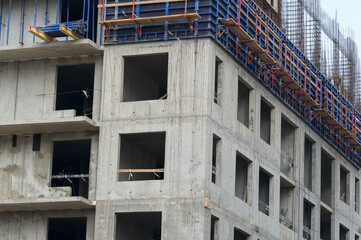 The facade of modern residential building under construction