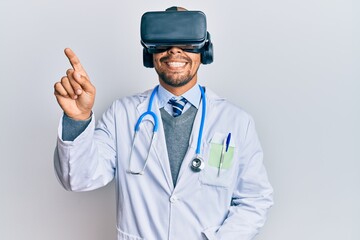 Young arab doctor man smiling happy wearing uniform and using 3d glasses over isolated white background.