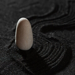 rock garden, white pebbles on black sand, wavy patterns.