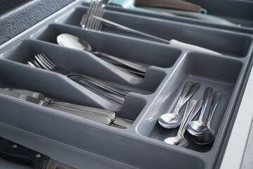 Kitchen utensils in drawer, close-up