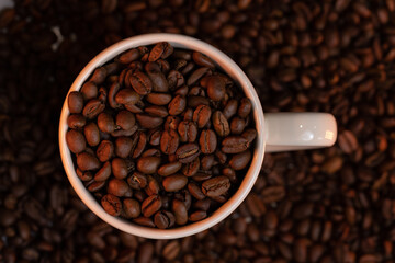 white cup of coffee beans 