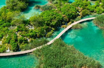 Plitvice lakes in Croatia. National Park in summer. Waterfalls and lakes among the forest. Footpath for hiking. Croatian travel image. © biletskiyevgeniy