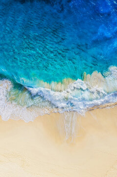 Travel and vacation image. Coast as a background from top view. Blue water background from air. Summer seascape from drone. Strong waves. © biletskiyevgeniy.com