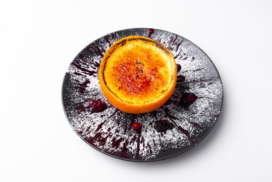 Tasty Creme Brulee In A Orange On Plate