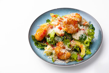 Fresh salad with shrimps and avocado, parmesan over white background