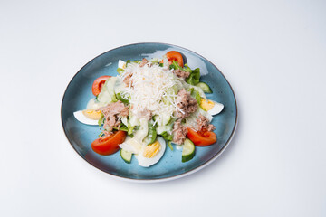 Photo of plate with fresh salad with eggs, tomatoes and cheese