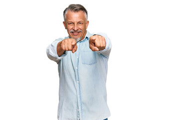 Fototapeta premium Middle age grey-haired man wearing casual clothes pointing to you and the camera with fingers, smiling positive and cheerful