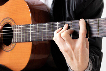 Fototapeta na wymiar young man playing guitar