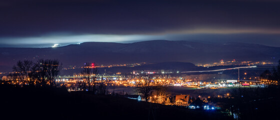 Fototapeta na wymiar Klodzko, night panorama of the city against the background of mountains.