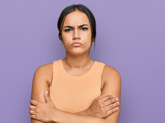 Young brunette woman wearing casual clothes skeptic and nervous, disapproving expression on face...