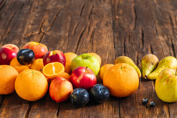 Naklejka na ściany i meble Healthy fruit on a wooden background. the concept of proper nutrition full of vitamin