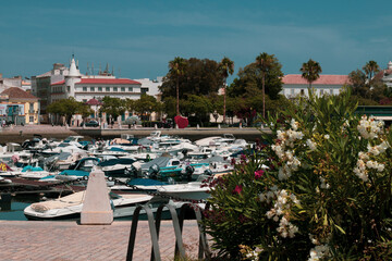 FARO, PORTUGAL - SEPTEMBER 8, 2020: colorful boats in the old harbor of Faro Marina, Portugal.