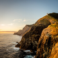 Fototapeta premium Cape Brett Lighthouse and Cape Brett Hut in Rawhiti New Zealand