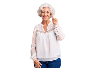 Senior grey-haired woman wearing casual clothes showing and pointing up with finger number one while smiling confident and happy.