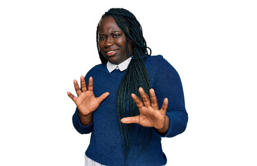 Young black woman with braids wearing casual clothes disgusted expression, displeased and fearful...