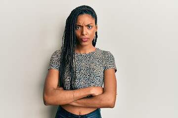 African american woman wearing casual clothes skeptic and nervous, disapproving expression on face with crossed arms. negative person.