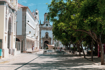 Naklejka premium Faro, Portugal - April 9 2020. View of the city center of Faro next to the harbor in a summer day. Algarve.