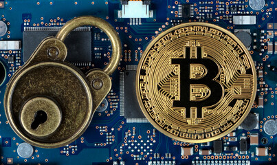 Bitcoin with lock on computer circuit board for future currency security and ransomware or malware
