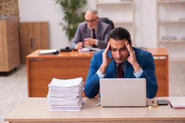 Two employees working in the office