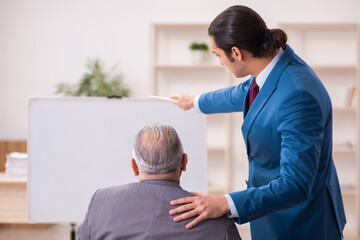 Fototapeta premium Two male employees in business meeting concept