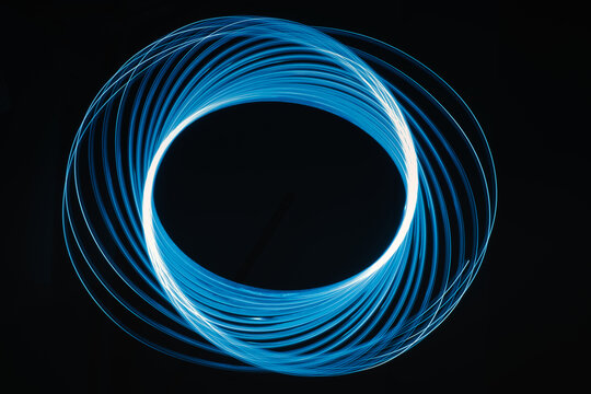 2021-03-06 Circular Blue And Wite Neon Ligths On A Black Background