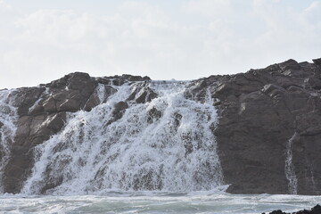 The sea demonstrating its power against the cliffs