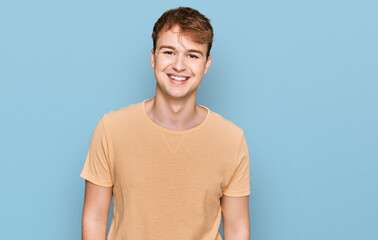 Young caucasian man wearing casual clothes with a happy and cool smile on face. lucky person.
