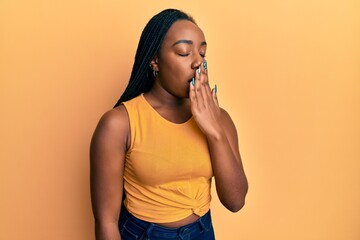 Young african american woman wearing casual clothes bored yawning tired covering mouth with hand. restless and sleepiness.