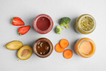 Flat lay composition with healthy baby food and ingredients on grey background