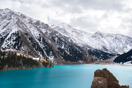 Big Almaty Lake In Kazakhstan In A Cold Winter Day. Snow Visible Around The Alpine Lake Located In The Trans Ili Alatau Mountain And Clean Water.