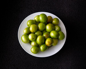 Umbu is a typical fruit endemic to the central region of Brazil. Top view. Black background