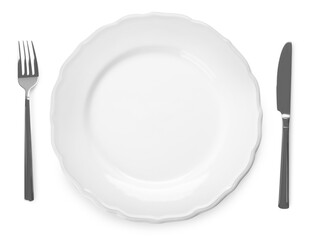 Plate and cutlery on white background, top view