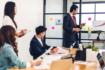 Group of professional business presentation meeting and discussing strategy with new startup project.Creative business people planning and brainstorm with laptop computer in modern office.Teamwork