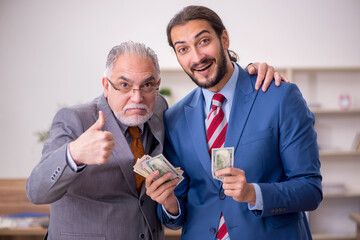 Two male employees in remuneration concept