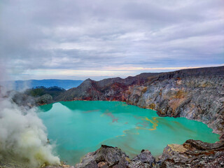 Fototapeta na wymiar Kawah Ijen volcanic ,Sulfur fumes from the crater of lake in Banyuwangi, East Java, Indonesia