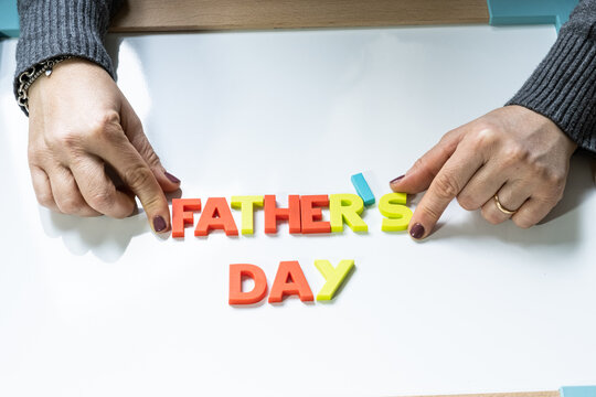 Father's day written on blackboard with colorful letters.
Happy Father's Day